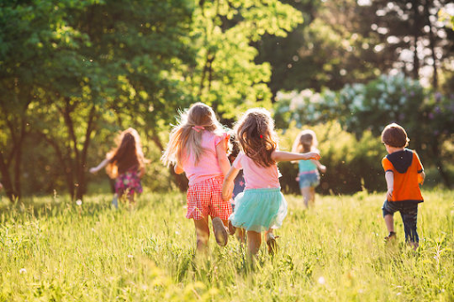 Children running joyfully outdoors